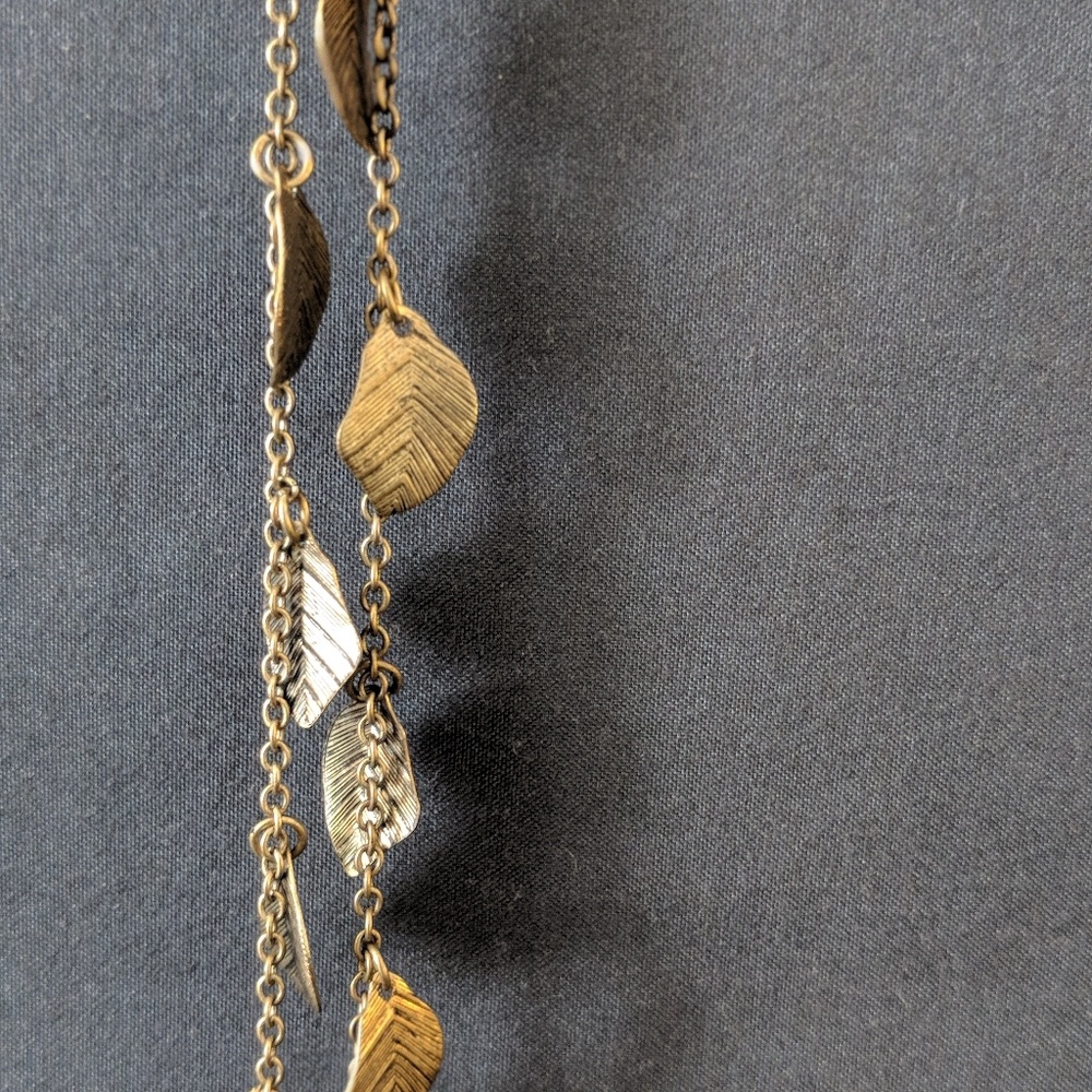 Gold feather necklace